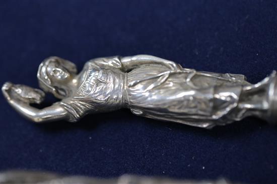 A pair of Victorian silver fish servers, with cast figural handles modelled as a fisherman and his wife, Francis Higgins III,